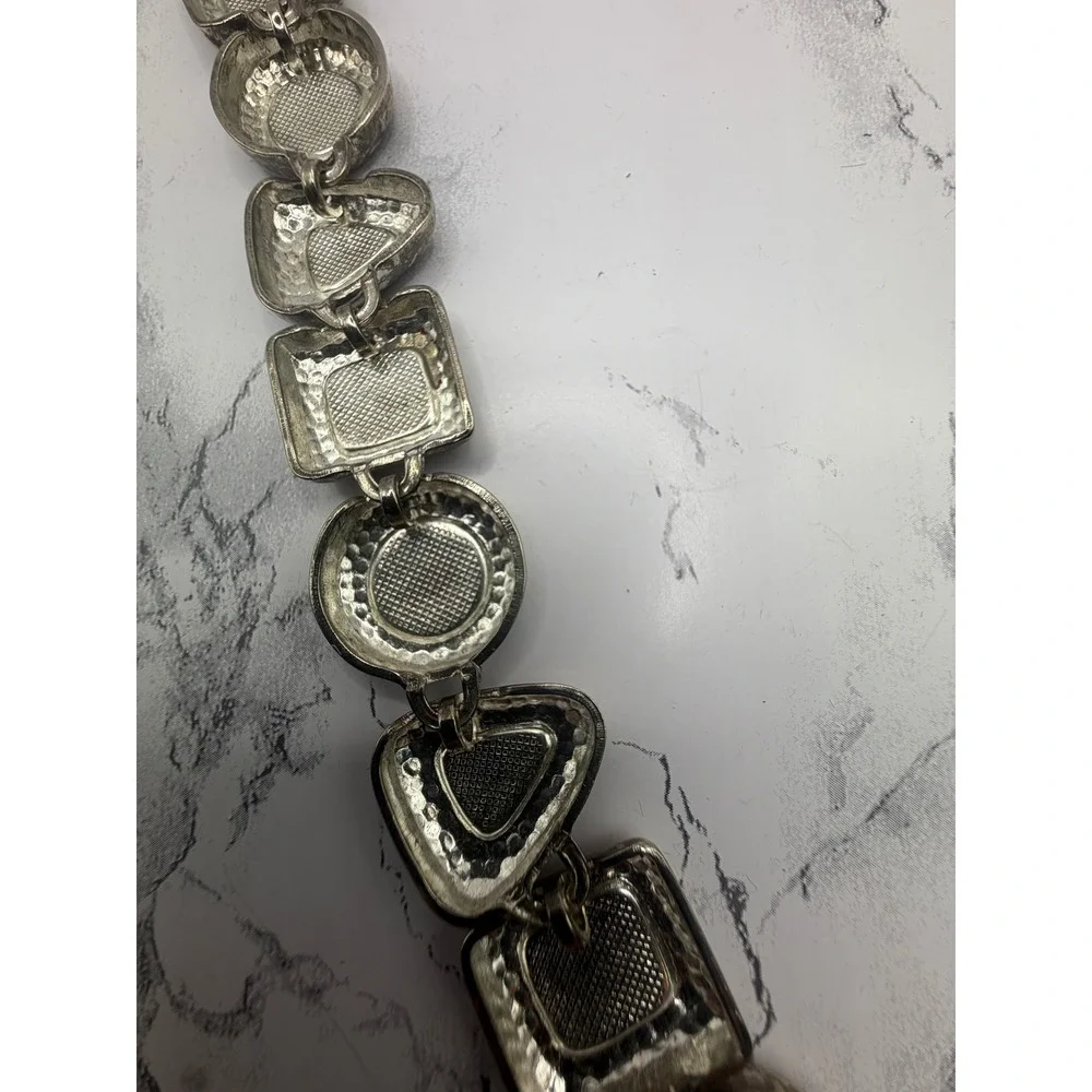 Source Unknown bold silver